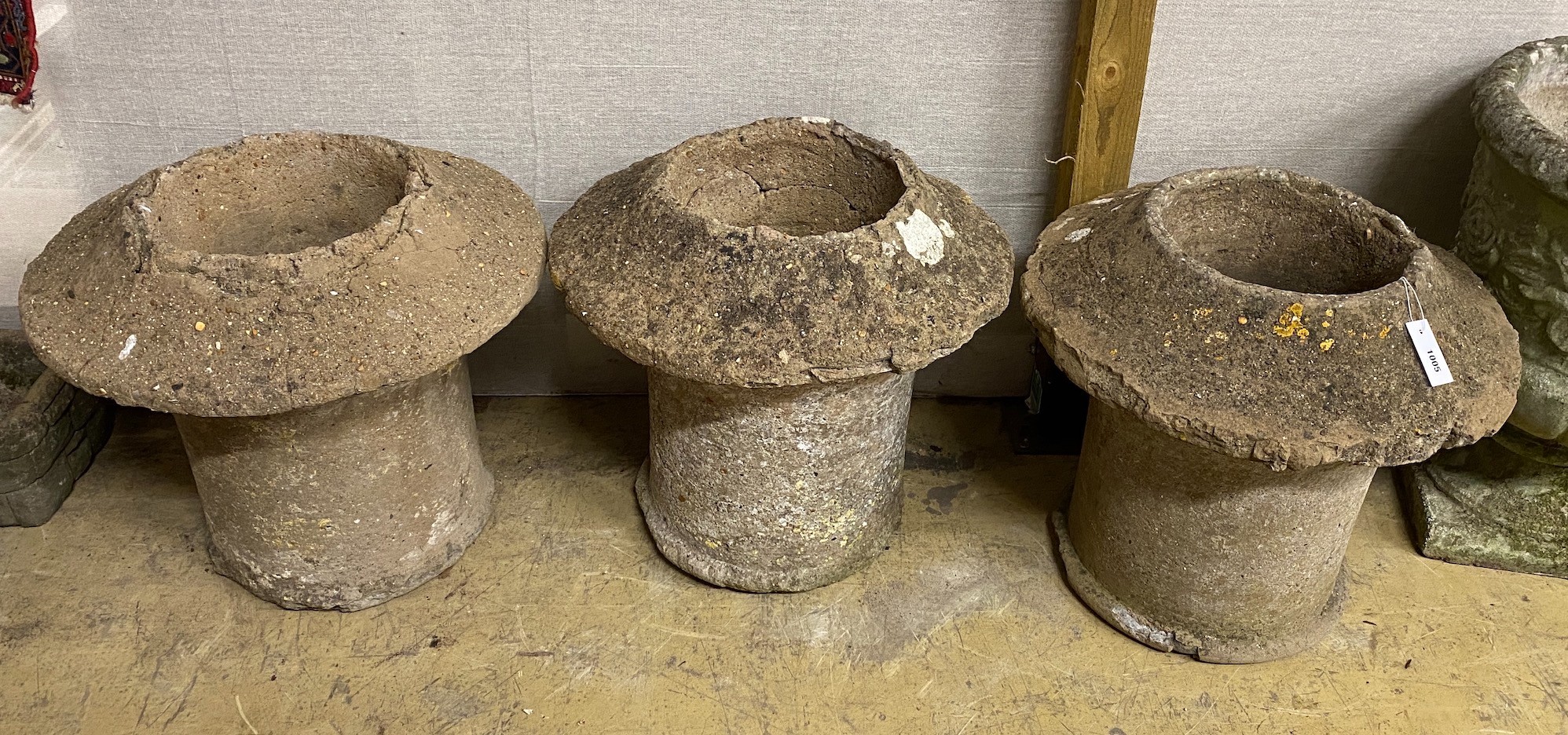 Three reconstituted stone chimney pot planters, diameter 54cm, height 50cm